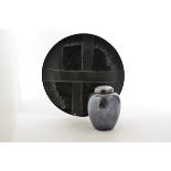 A Poole Pottery charger, abstract black matt pattern on gloss black ground, 39.5 cm diameter;