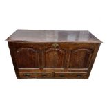 An 18th Century oak mule chest, hinged top revealing interior with candle tray and two drawers,