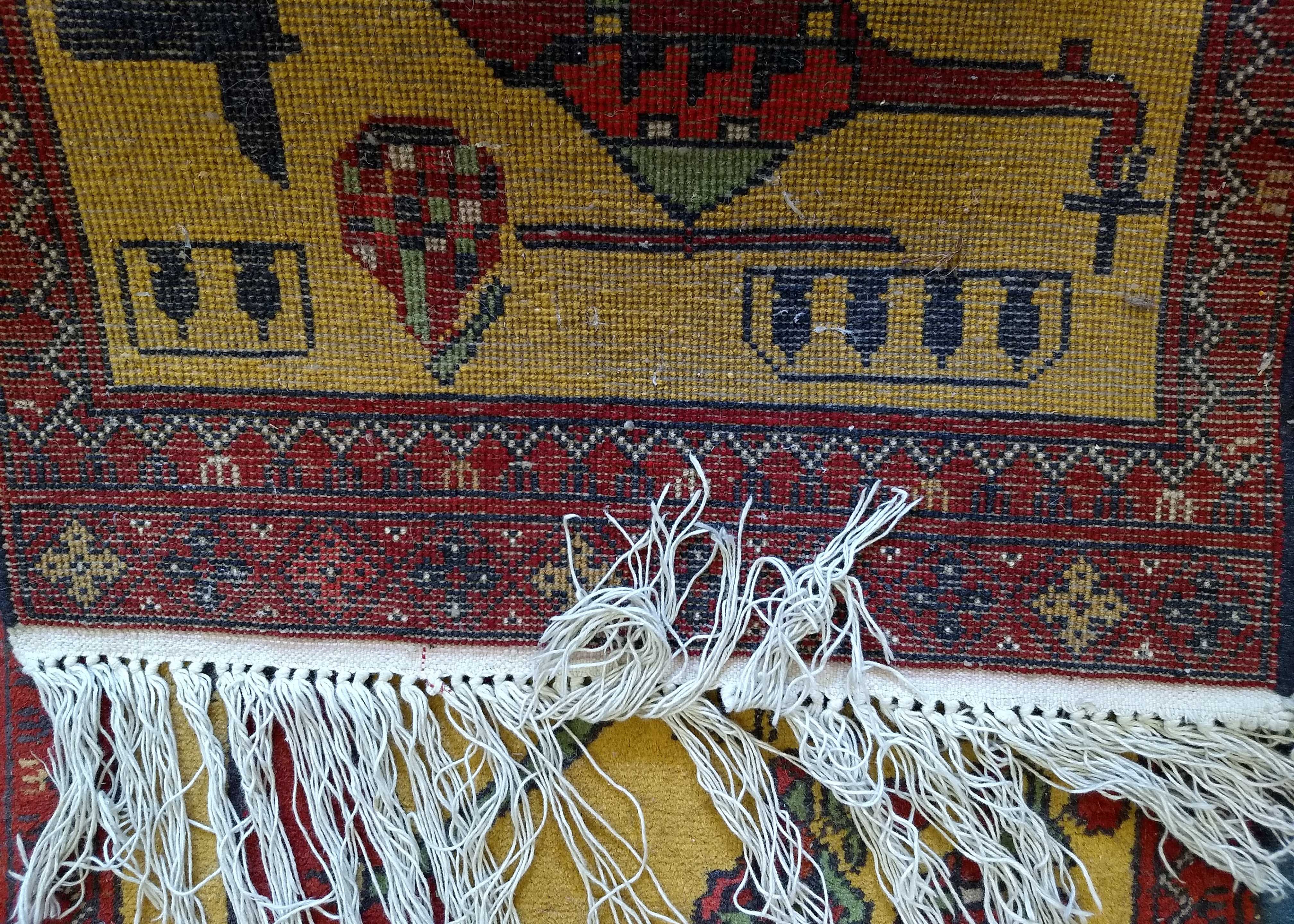 An Afghan woollen war rug, helicopter, guns and grenades on yellow ground, red patterned border, 100 - Image 3 of 3