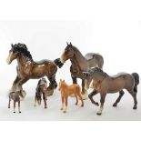 A collection of 15 Beswick porcelain models of horses, including Cantering Shire, no. 975, 22 cm