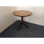 A Georgian mahogany tilt-top tripod table, turned columns, three splayed feet, 72 cm diameter x 72