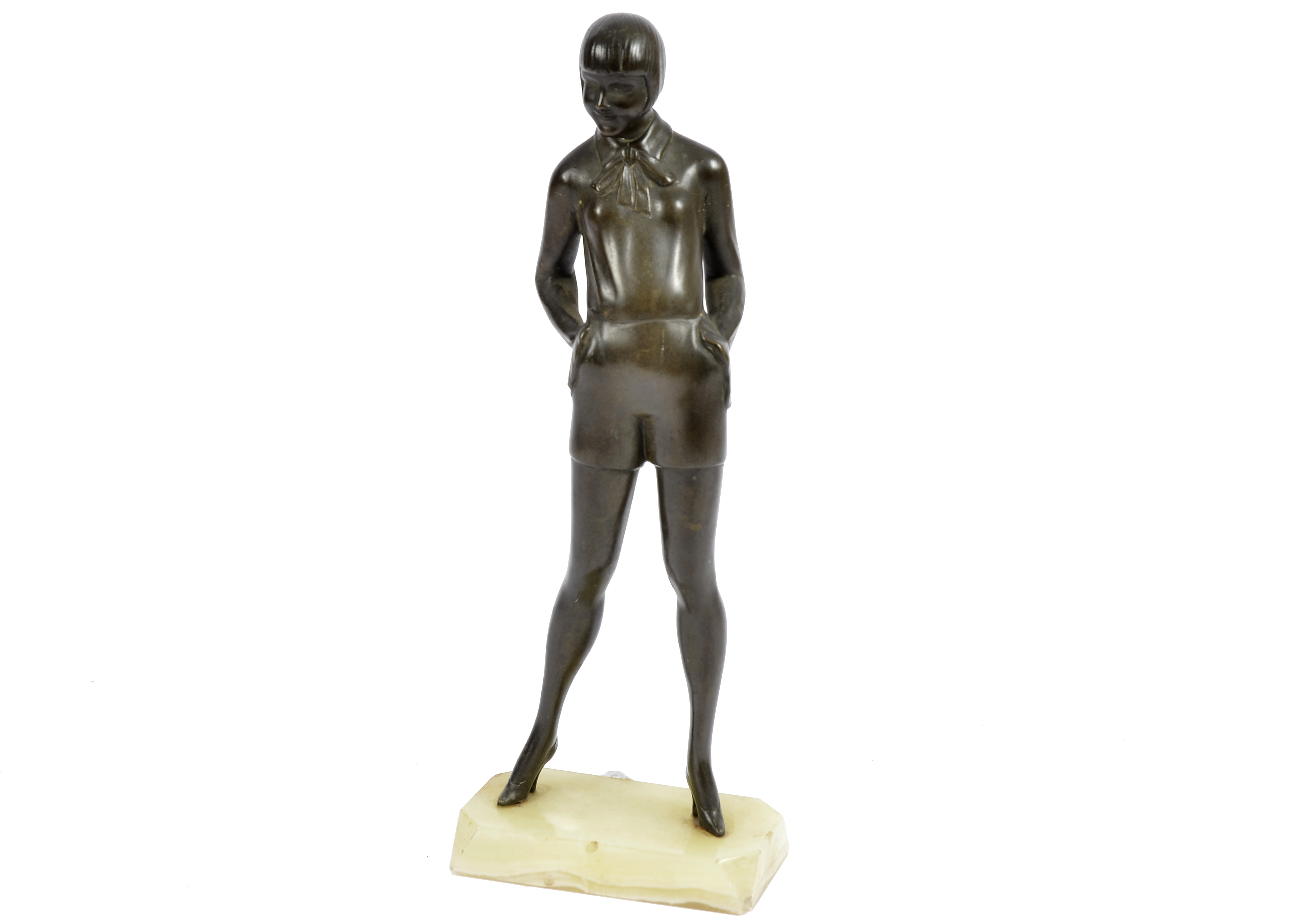 An Art Deco bronze sculpture of a woman standing with hands in her pockets, rectangular marble