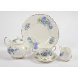 A Royal Grafton tea set for two in the 'Blue Wild Flowers' pattern, together with a set of six