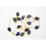 A lapis lazuli necklace, gilt metal chain links, unmarked