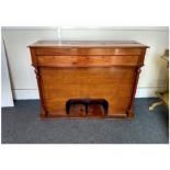 A yew wood cased harmonium, five octaves, ogee footwell, missing bellows, 103 cm wide x 35 cm deep x