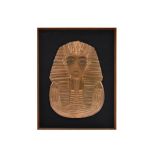 A 20th Century copper relief panel of Tutankhamun's death mask, 51.5 cm x 35.5 cm, framed