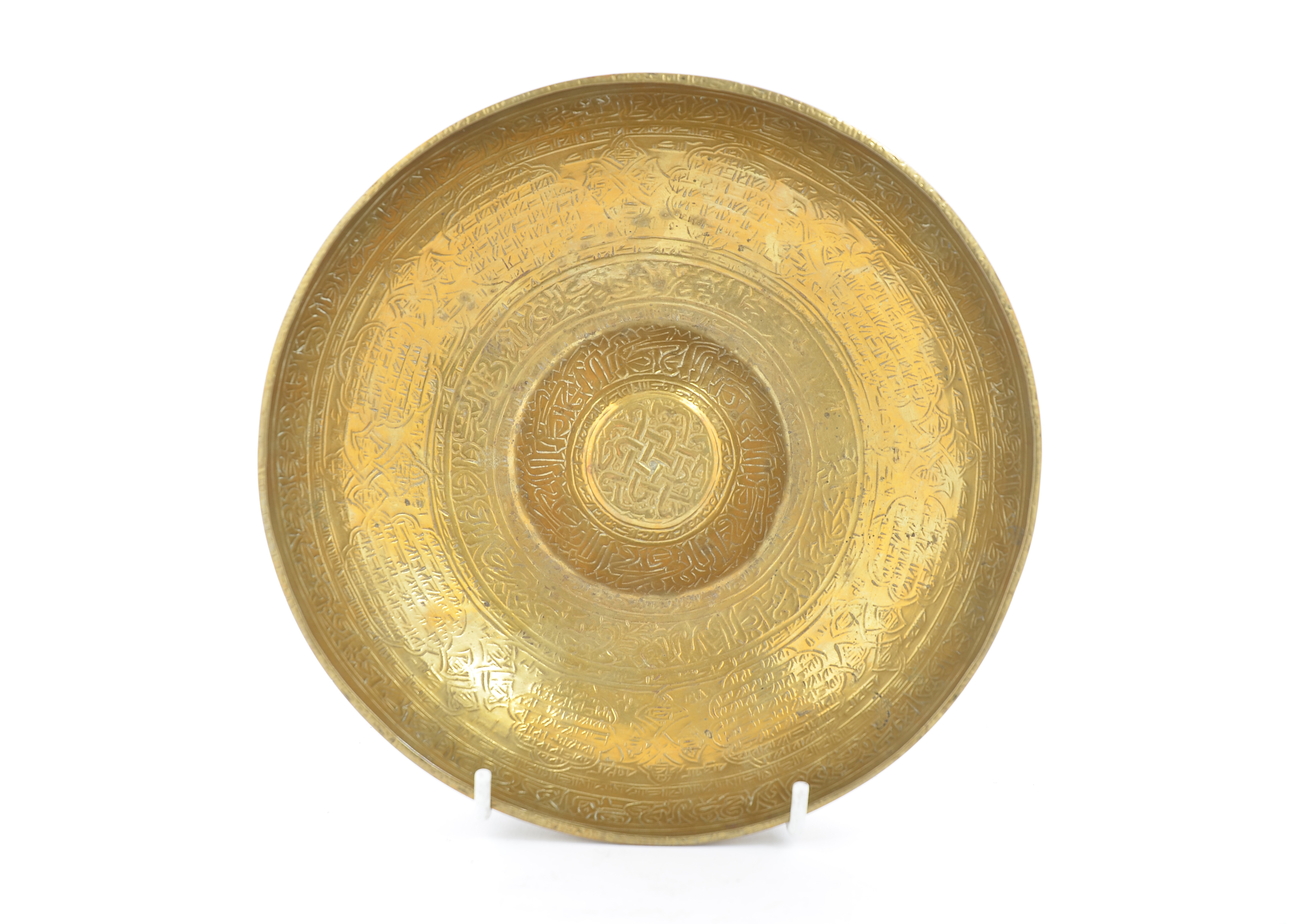 A 19th Century Middle-Eastern brass divination bowl, decorated with Arabic script, 21 cm diameter