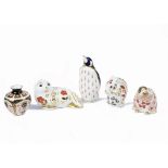 A group of four Royal Crown Derby porcelain paperweights, comprising beaver, silver stopper, 1994,