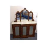 A Victorian walnut and inlaid credenza, marble top with triple arched mirrored back, base with