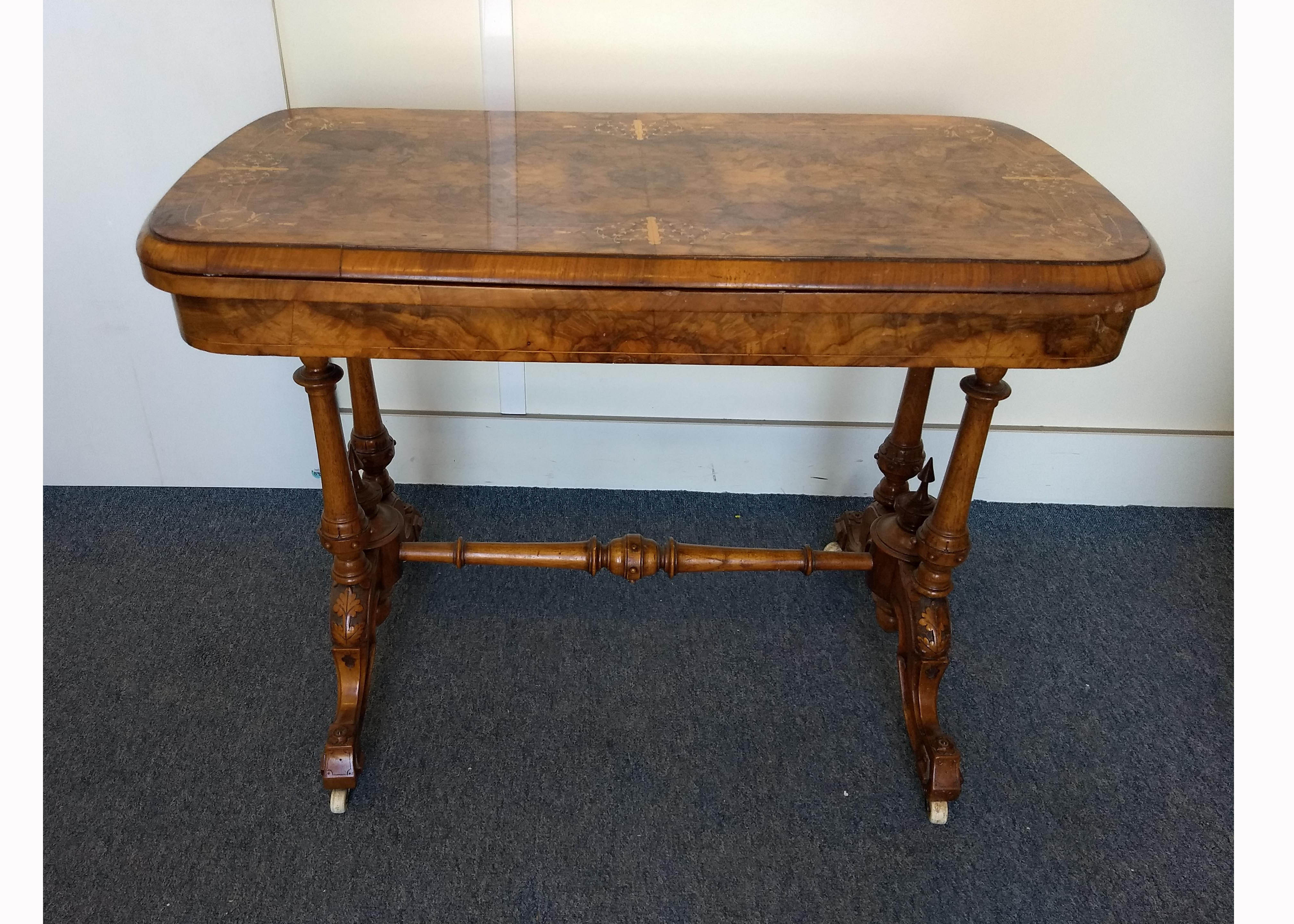 A Victorian burr walnut and inlaid card table, quarter veneered top with scroll inlay, hinged and