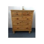 A 19th Century waxed pine chest-of-drawers, two short over three graduated long drawers, turned