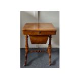 A 19th Century walnut sewing table, rectangular hinged top revealing fitted green baize interior