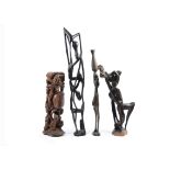 A collection of modern African items, comprising three Makonde style figures, a Nupe multi-spouted