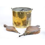 A brass log bucket, swing handle, tin liner, 36 cm diameter x 30 cm high; together with two pairs of