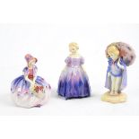 Three Royal Doulton models of young girls, 'Marie', HN 1370, 12.5 cm high; 'Monica', HN 1467, 10.5