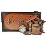 A Black Forest cuckoo clock with dancing figures, chalet case, playing Pretty Blue Danube Waltz