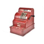 A Danish brass cash register by National, painted red and bearing a plaque numbered '3860215 N1640',