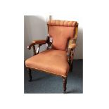 An Edwardian rosewood and satinwood inlaid armchair, terracotta backrest, arms and stuffover seat,