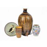 A collection of studio pottery, including a 1930s Poole Pottery vase with floral decoration by