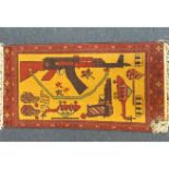 An Afghan woollen war rug, helicopter, guns and grenades on yellow ground, red patterned border, 100