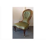 A Victorian walnut spoon-back chair, green button-back upholstery, cabriole front legs, ball feet,