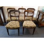 A set of five William IV rosewood dining chairs, scroll decorated backs, floral tapestry stuffover