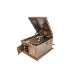 An HMV table grand gramophone. model 103, in oak case, with brass-backed No 4 soundbox, 1927 (good