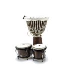 Hand Drums, a 62cm high African style drum together with a LP made pair of drums which has damage to