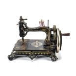 An Atlas B sewing machine, with shuttle and gilt decoration