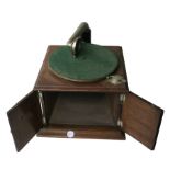 A hornless gramophone, Dulcephone, with Dulcephone soundbox, in oak case with motor below horn (no