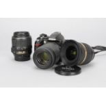 A Nikon D3000 DSLR Camera, with 55-200mm f/4-5.6 DX VR Nikor lens, 18-55mm f/3.5-5.6 DX Nikor