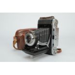 A Ziess Ikon Ikonta 524/2 Folding Camera, with 105mm f4.5 Nova-Anastigmat lens, shutter sticking
