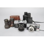 A Group of Cameras and Accessories, a Zenit EM SLR camera, a Braun Paxette 28 LK 126 cartridge