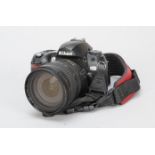 A Nikon D70 DSLR Camera, with AF-S Nikkor 18-70mm f/3.5-4.5G lens, battery, no charger, condition F,