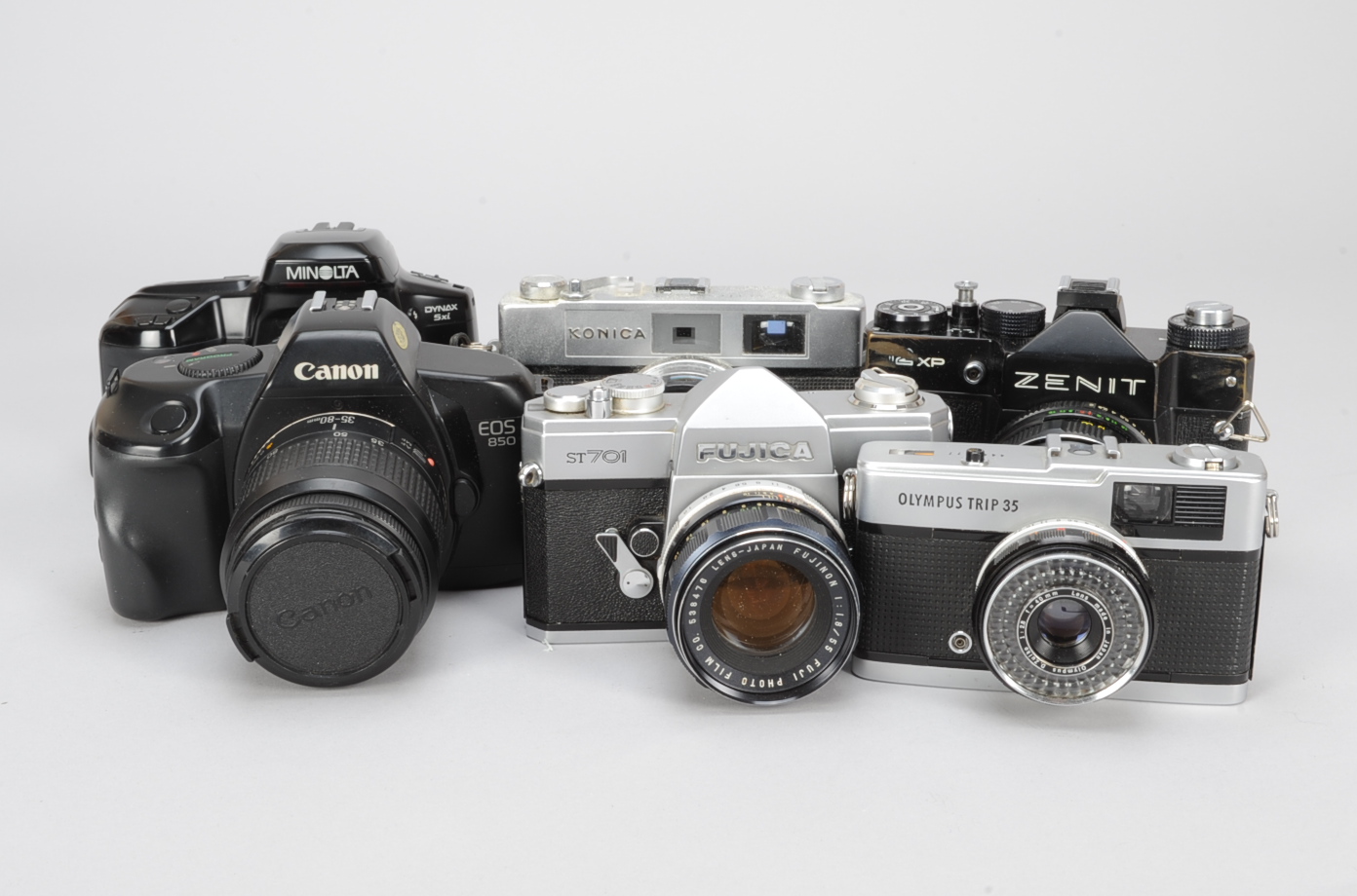 A Group of 35mm Film Cameras, comprising a Canon EOS 850 camera with EF 35-80mm f/4-5.6 III, a