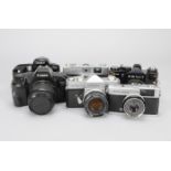 A Group of 35mm Film Cameras, comprising a Canon EOS 850 camera with EF 35-80mm f/4-5.6 III, a
