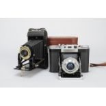 An Agilux Agifold Rangefinder Folding Camera, with 75mm f/4.5 lens, shutter working, body G,