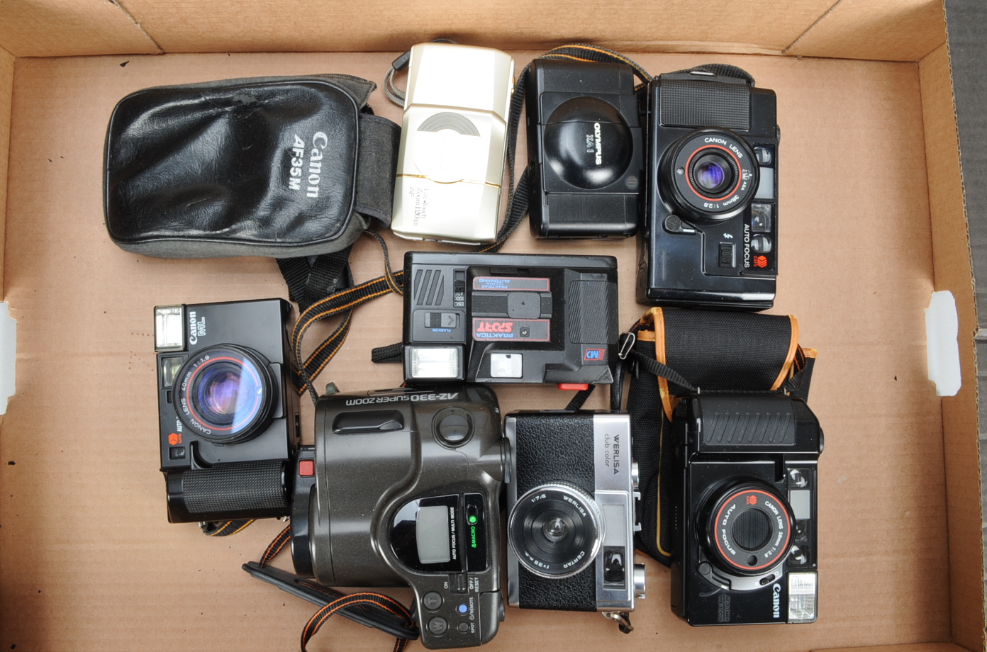 A Tray of Compact Cameras, including an Olympus XA-1, Canon sure shot, AF35M, AF35ML, Nikon zoom 120