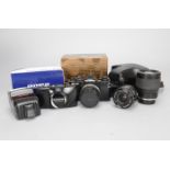 An Olympus OM-4 Ti SLR Camera and OM Mount Lenses, black, shutter working, maker's box and ERC, a