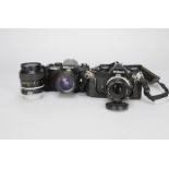 A Nikon FM and a Nikon F-301 SLR Cameras, a black FM camera, serial no 2337448, shutter working,