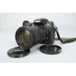 A Nikon D300 DSLR Camera, serial no 8015583, with an AF-S Nikkor 18-200mm f/3.5-5.6G VR ED DX