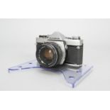 An Olympus OM-1 SLR Camera, with F Zuiko 50mm f/1.8 lens, shutter working, body VG, elements F,