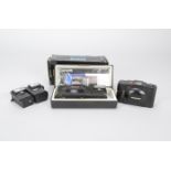 An Olympus XA2 35mm Compact Camera, in maker's sleeve and presentation case with instructions and