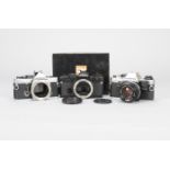 Olympus OM Camera Bodies, a chrome Olympus OM-2n, boxed with manual, rewind lever detached from