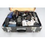 Compact Cameras, manufacturers include, Olympus, Canon, Pentax, other examples, in black camera case