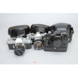 Three Canon SLR Cameras, a Canon A-1 (bLack) with motor drive, EX Auto QL with 50mm f/1.8 lens, FX