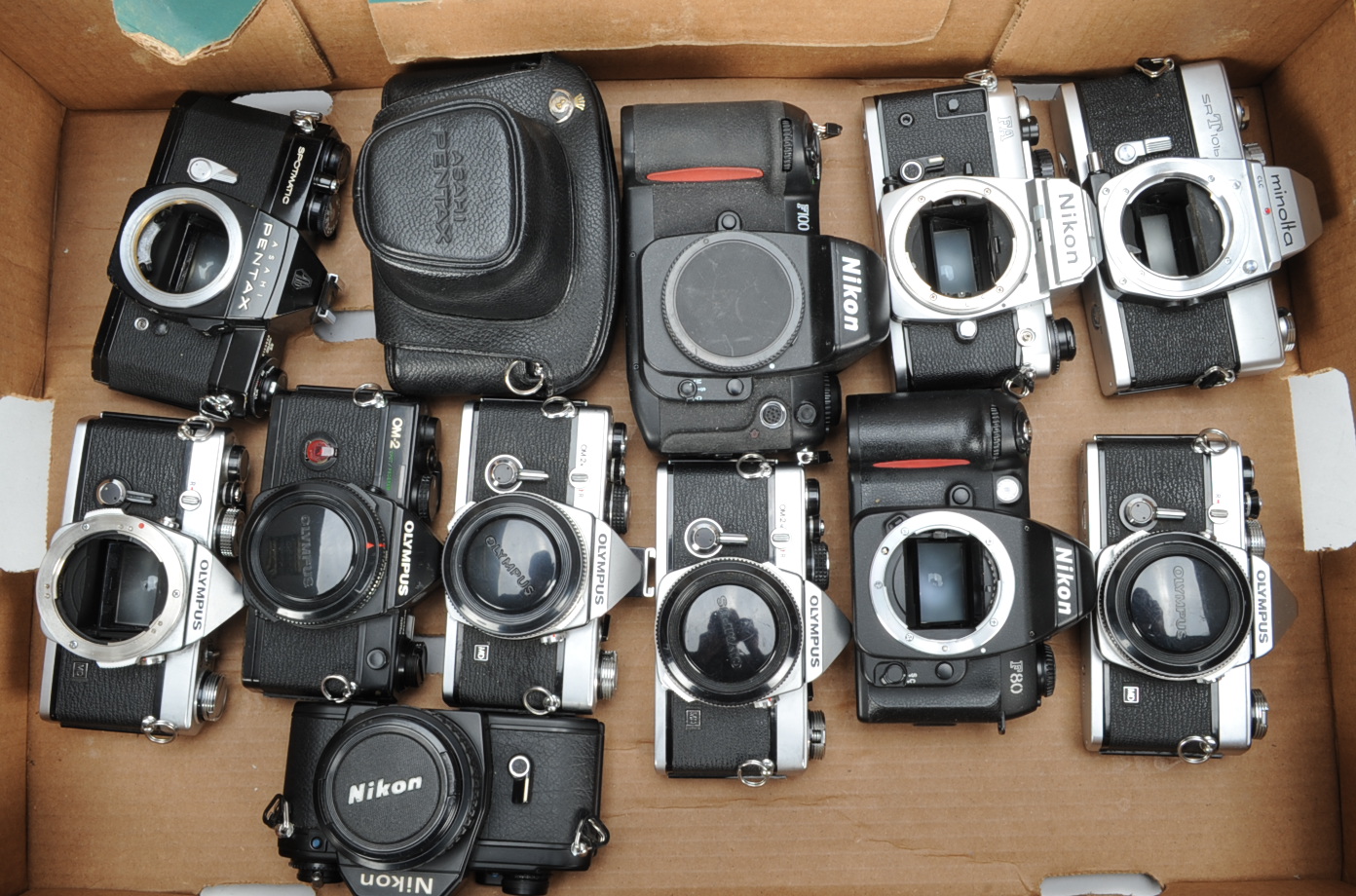 A Tray of SLR Camera Bodies, Asahi Pentax Spotmatic II (2), a Minolta SRT101b, a Nikon F100 (battery