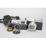 Three 35mm Compact Cameras, an Olympus 35 RC rangefinder camera, a Voigtländer Vito C camera and a