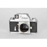 A Nikon F Photomic SLR Body, chrome, serial no 7219688, shutter working, condition Fair, paint