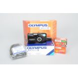 An Olympus mju II All Weather 35mm Compact Camera Kit, in makers box, with 35mm film, leather